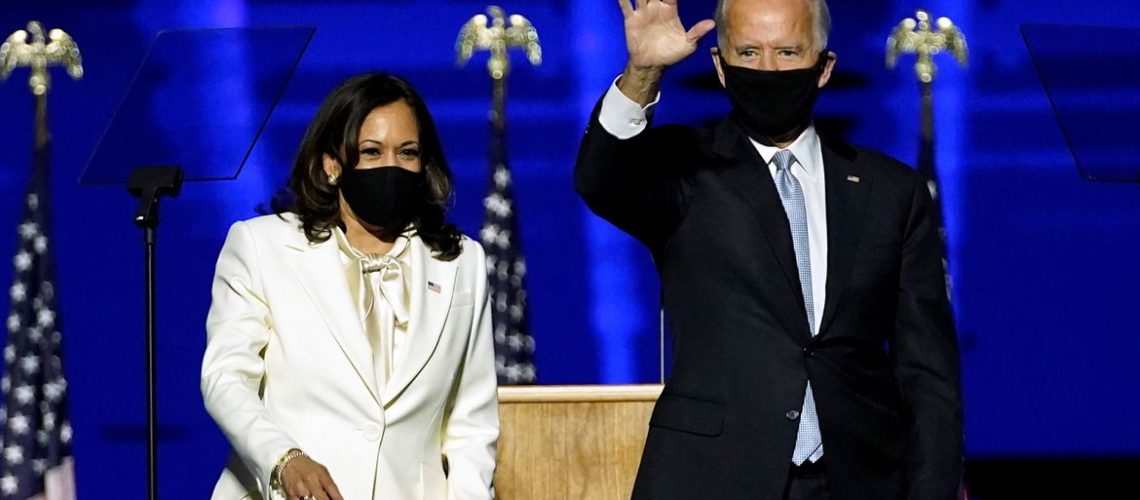 Democratic vice-presidential nominee Kamala Harris and Democratic 2020 U.S. presidential nominee Joe Biden greet supporters at an election rally, after news media announced that Biden has won the 2020 U.S. presidential election, in Wilmington, Delaware, U.S., November 7, 2020. Andrew Harnik/Pool via REUTERS